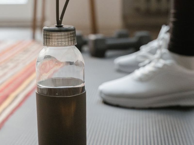 Detailed close-up of yoga mat and water bottle